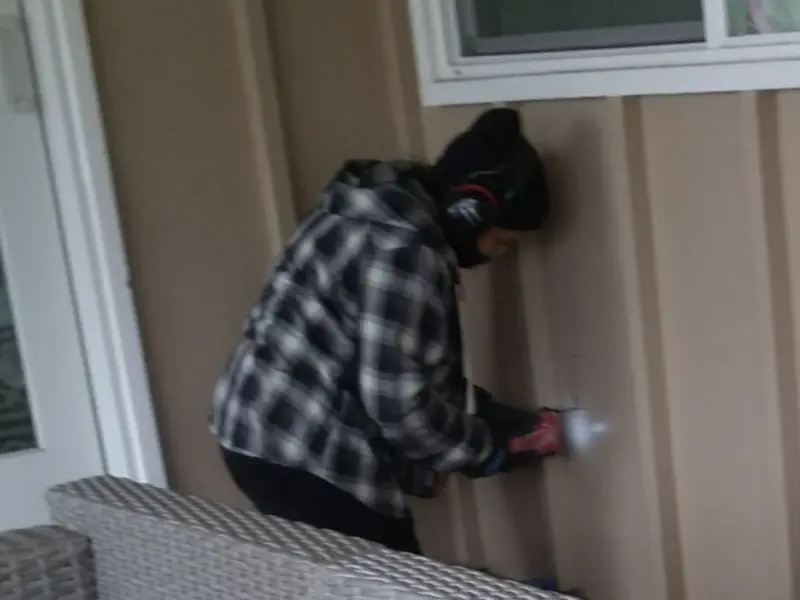 Professional electrician installing an exterior outlet in Picture Rocks