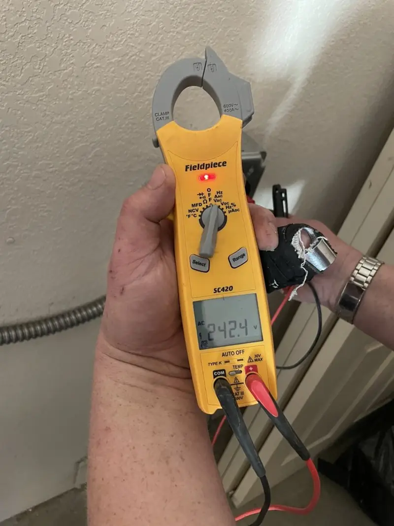 Voltage testing with clamp meter during Circuit Breaker Repair in Picture Rocks